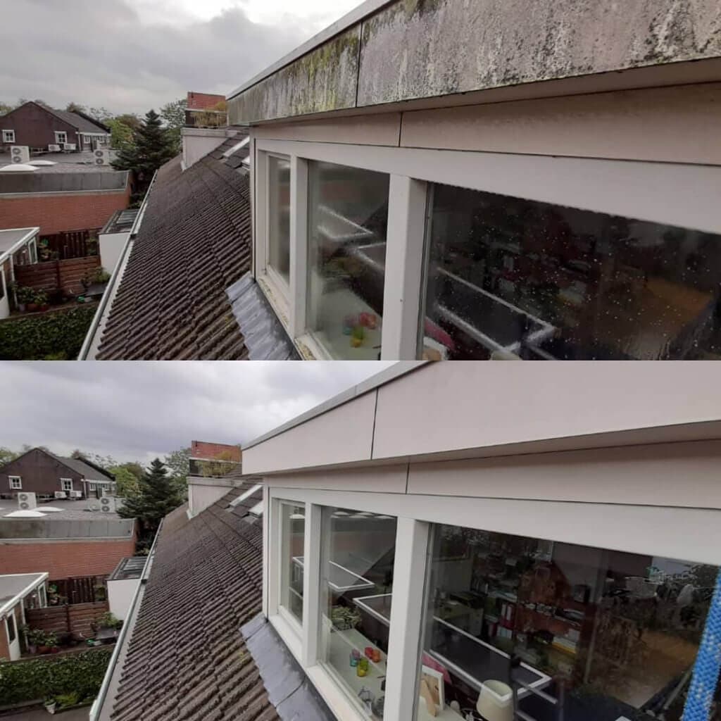 Specialist reinigt dakkapel veilig op hoogte